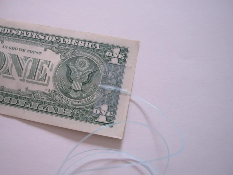 Dollar bill on a string